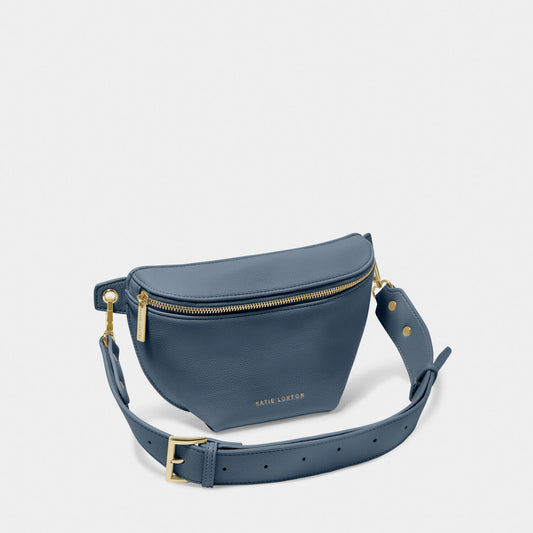 A belt bag in faux leather and navy blue with gold hardware