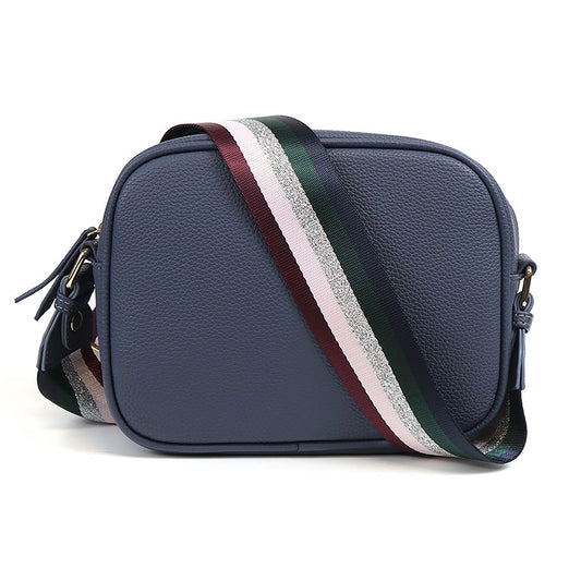 Navy vegan leather cross body camera bag with silver glitter and jewel tone striped print woven strap
