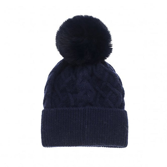 A simple deep blue navy cable knit hat with large fluffy pompom