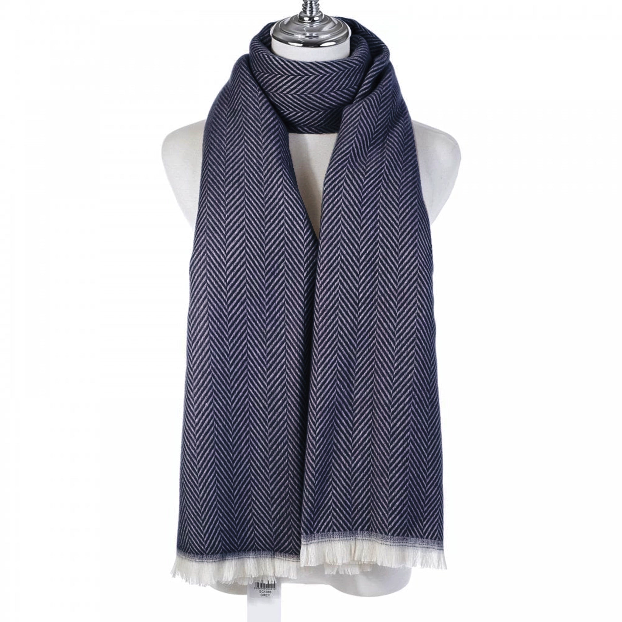 A navy chevron patterned scarf with a white fringe