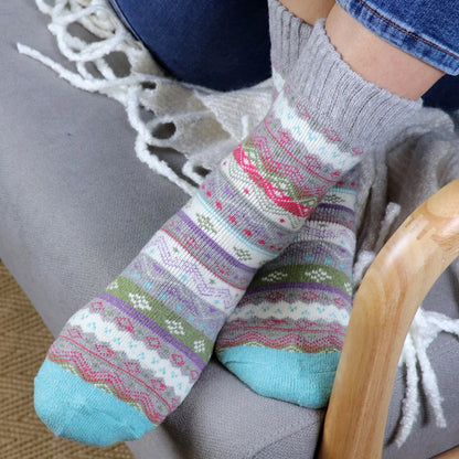 Model wearing Nordic striped patterned socks in grey marl and aqua