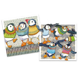 Some square notecards featuring illustrations with puffins in patterned jumpers