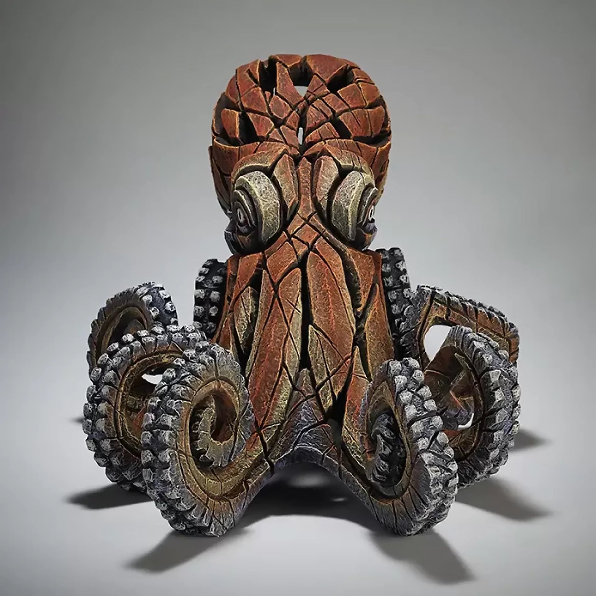 A textured and painted octopus sculpture front