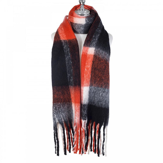 A chunky knit black and orange check patterned scarf with tassel trim