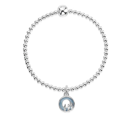 Silver stretch bracelet with a round blue grey enamelled charm with standing stone design