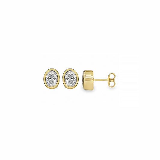 Gold stud earrings in an oval shape with a faceted CZ stone in the centre