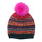 A striped patterned hat in red, navy and orange with a bright pink fluffy pom pom