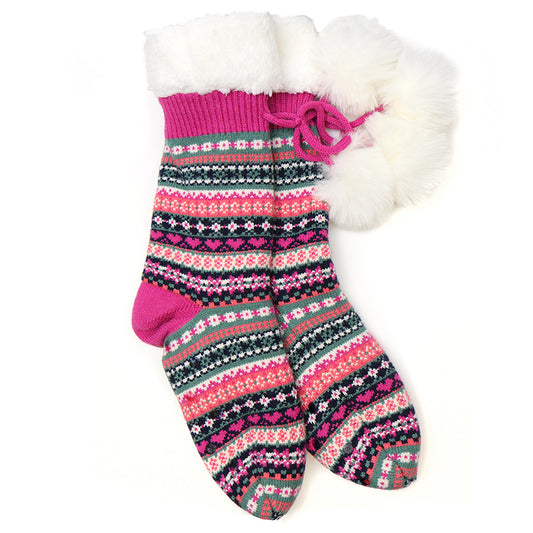 A pair of slipper socks with fluffy pompoms and patterned stripes