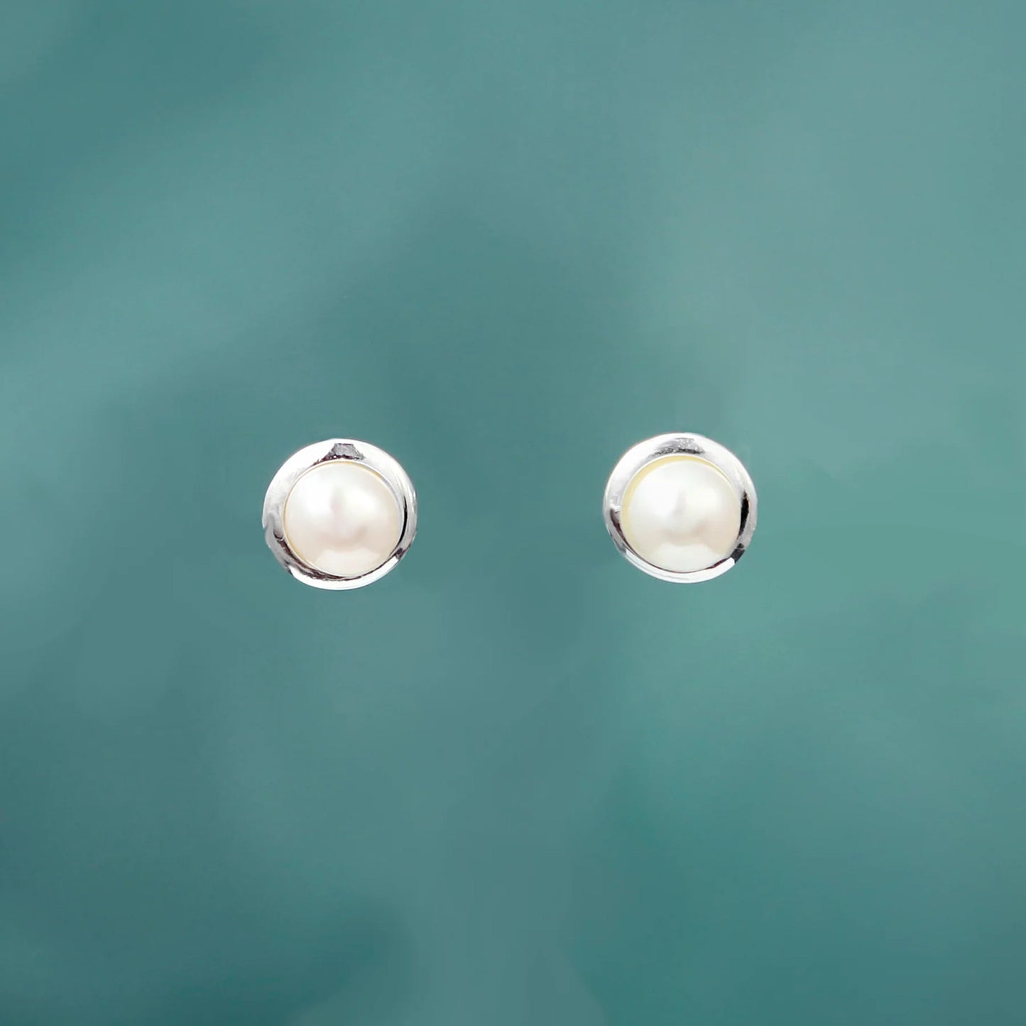 Silver round stud earrings with white freshwater pearls