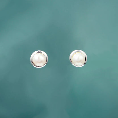 Silver round stud earrings with white freshwater pearls