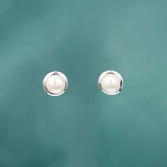 Silver round stud earrings with white freshwater pearls