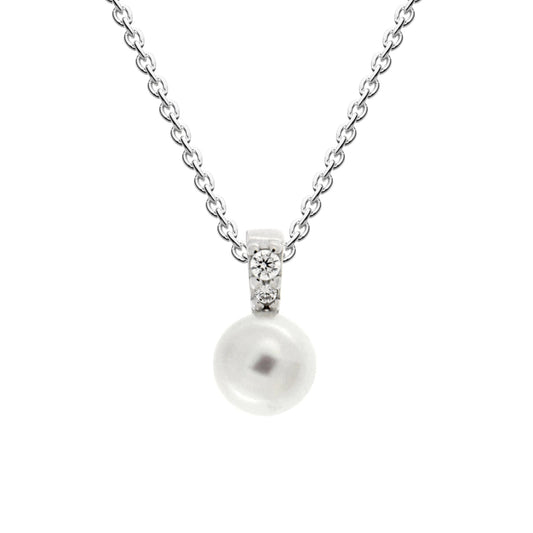 A silver pendant with a round freshwater pearl on a bail with CZ stones