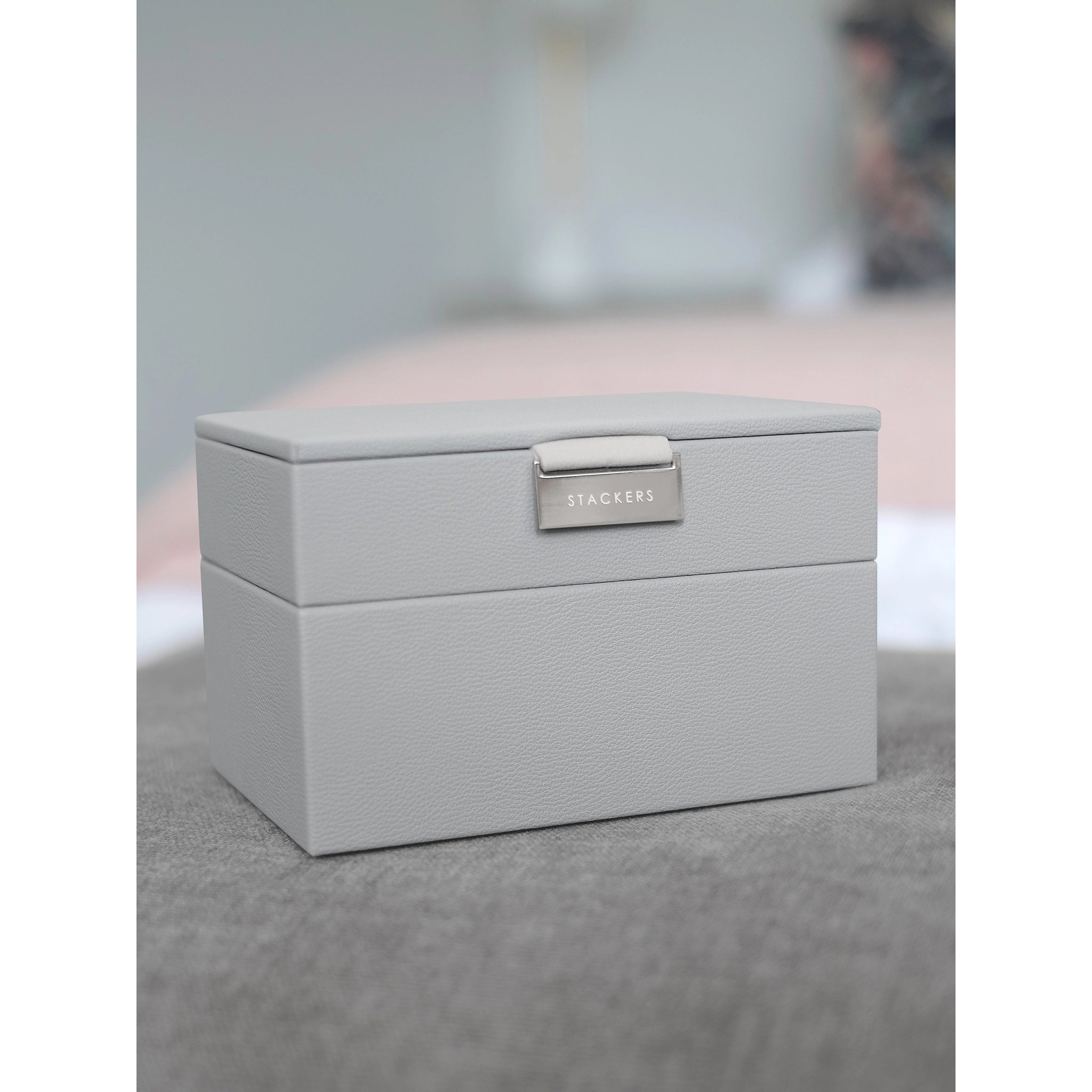 A stacked mini faux leather jewellery box with velvet interior and 2 levels closed