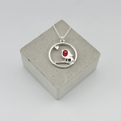 Silver pendant with framed red enamel robin and heart detail on silver chain
