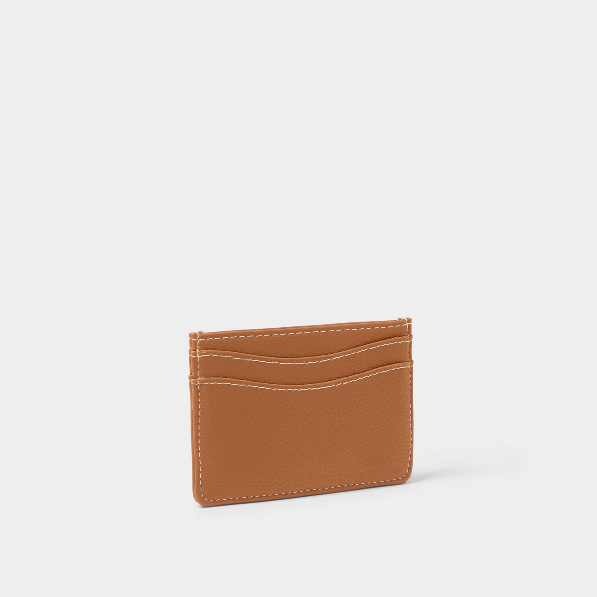 A faux brown leather card holder with contrasting light stitching