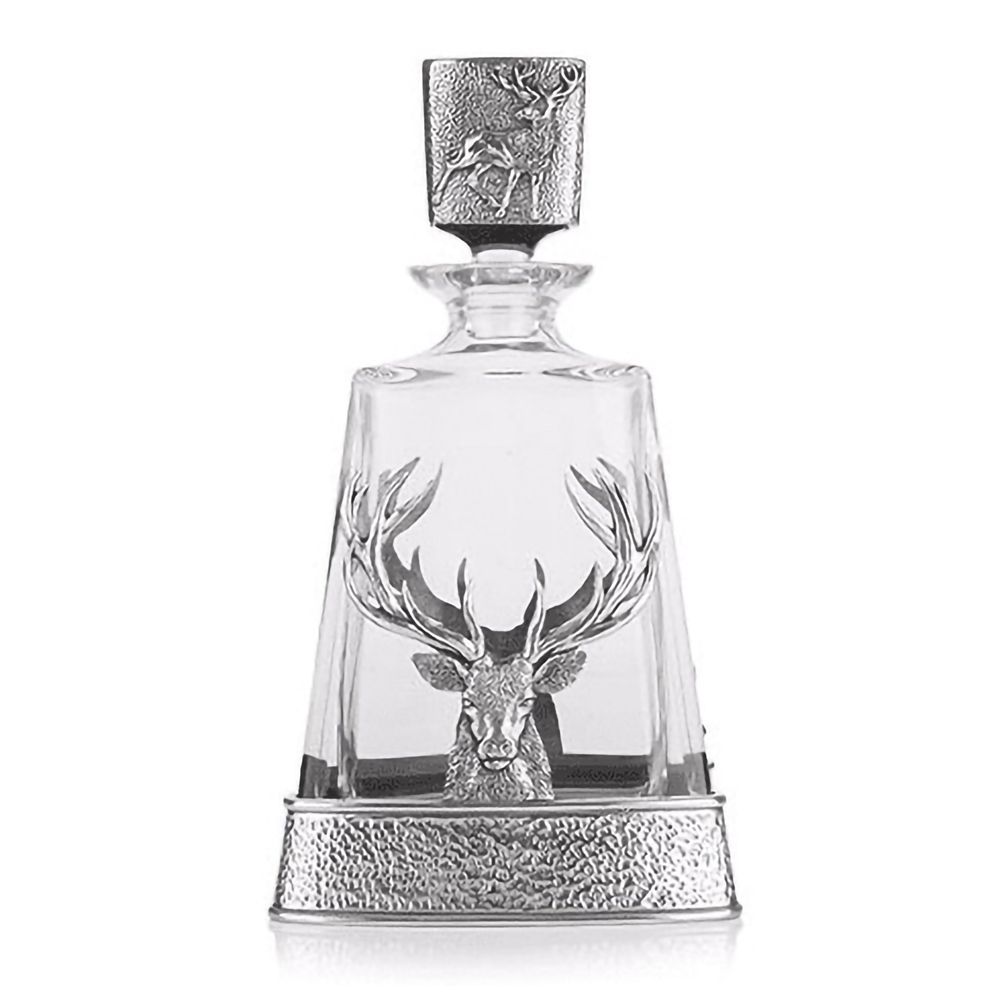 A glass decanter with a pewter base featuring a large stag head and a stopper lid featuring a standing stag