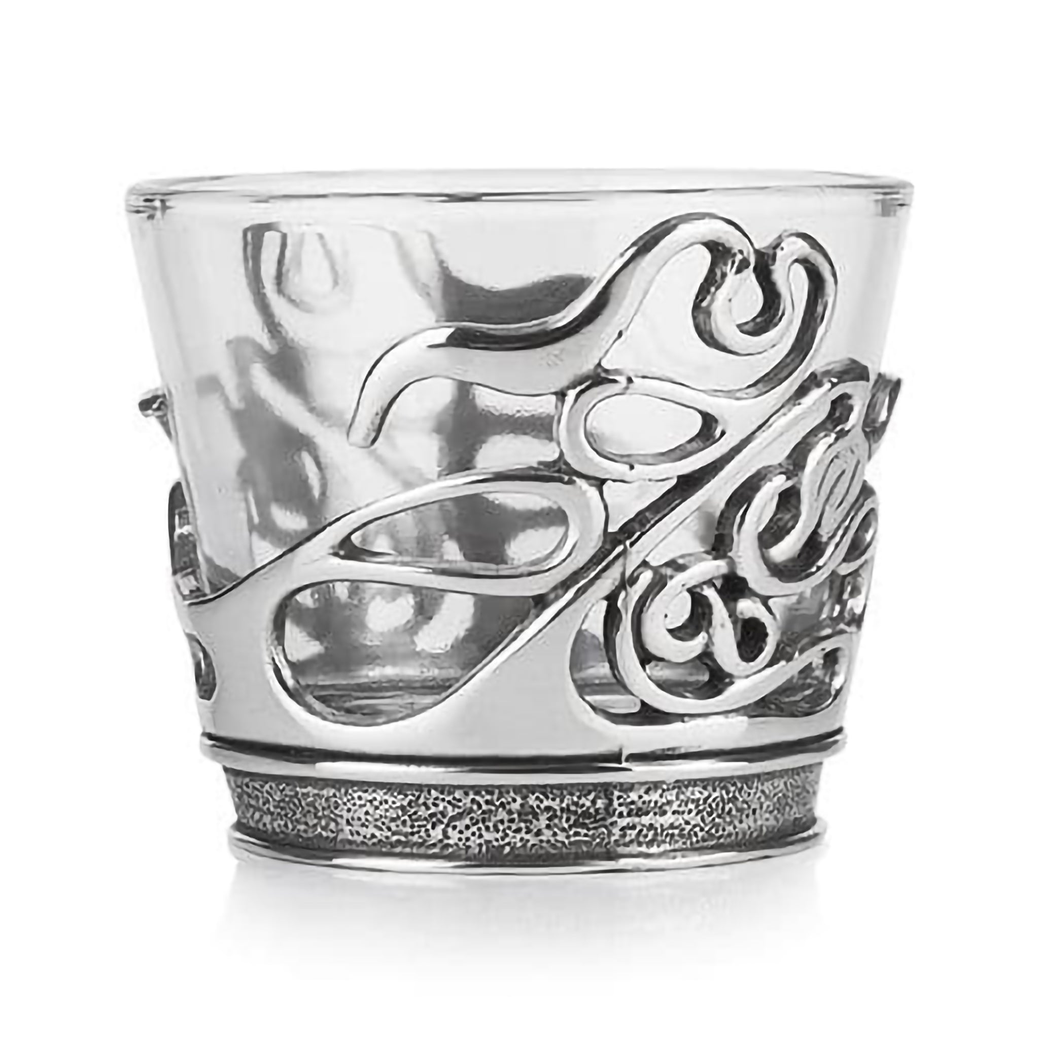 A glass tealight holder with pewter base featuring abstract swirl design