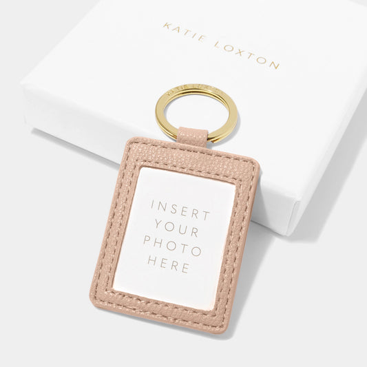 Back of a faux leather nude pink keyring with a clear fronted photo insert