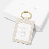 Back of a faux leather off-white keyring with a clear fronted photo insert