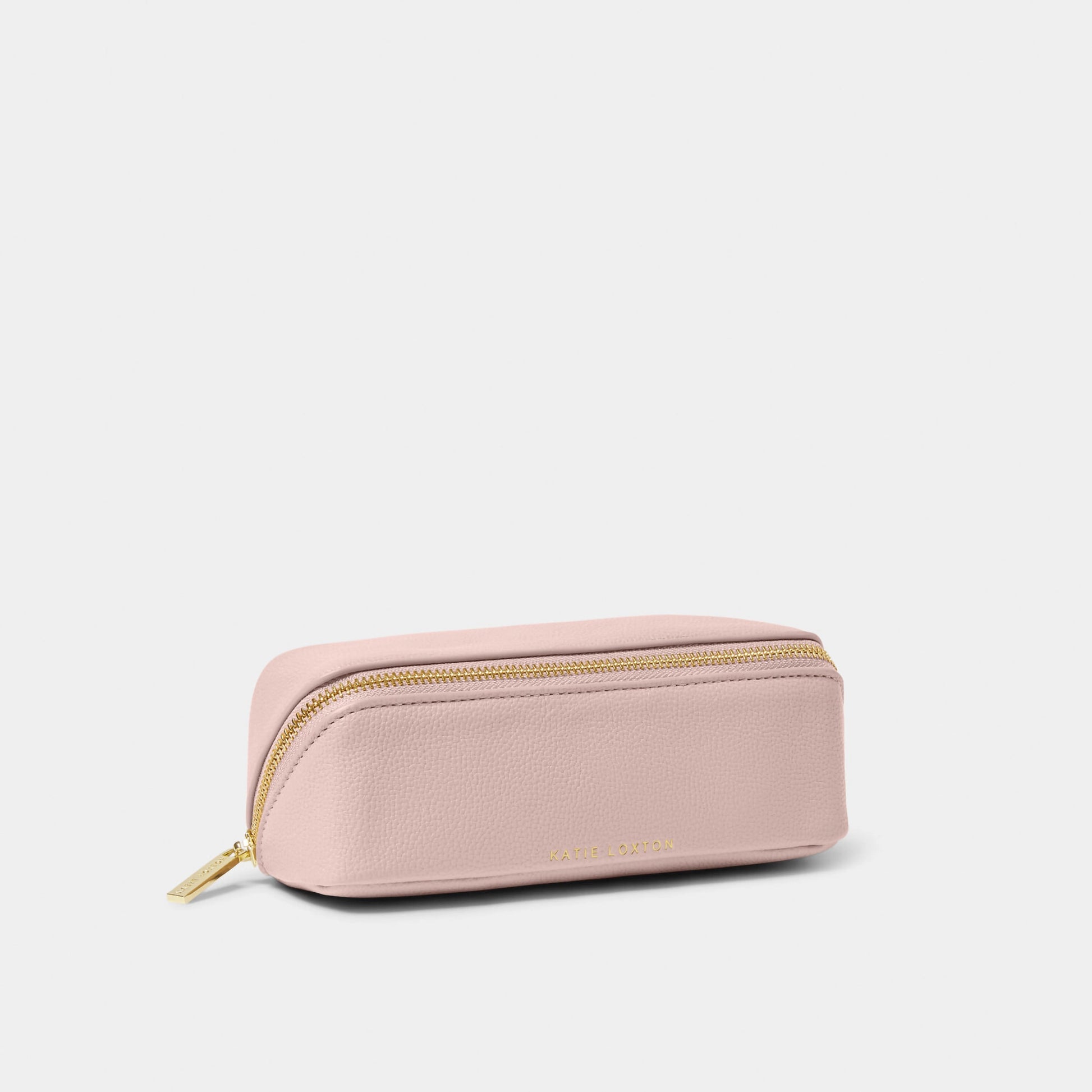 A pink makeup and wash bag with a gold zip in faux leather