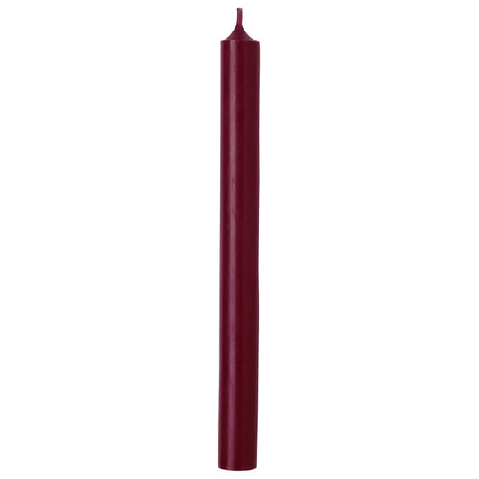 Tall dinner candle with simple straight cylinder shape in rich plum red colour