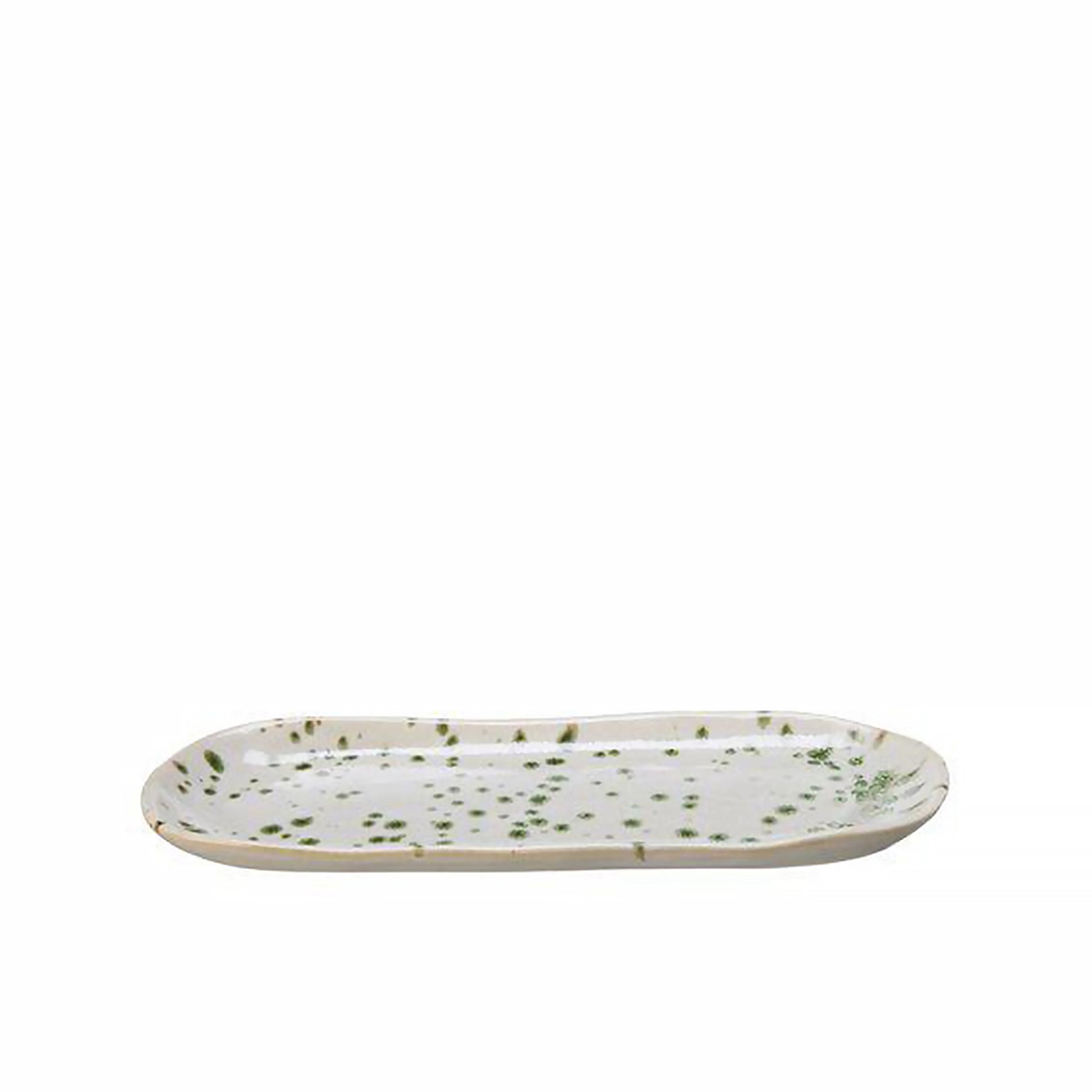 A long rounded plate in off-white with a green splatter pattern