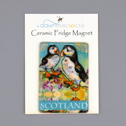 A rectangular fridge magnet featuring a pair of puffins with 'Scotland' on the bottom