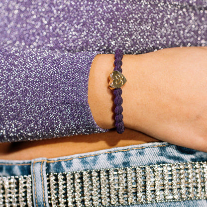 Model wearing a purple coloured bubble shaped hair tie with gold heart charm