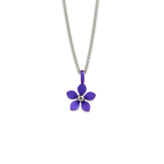 A pendant with a purple 5 petal flower on a silver chain