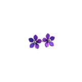 A pair of stud earrings featuring purple 5 petal flowers with polished titanium bead centres