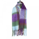 A chunky knit purple, blue and green check patterned scarf with tassel trim