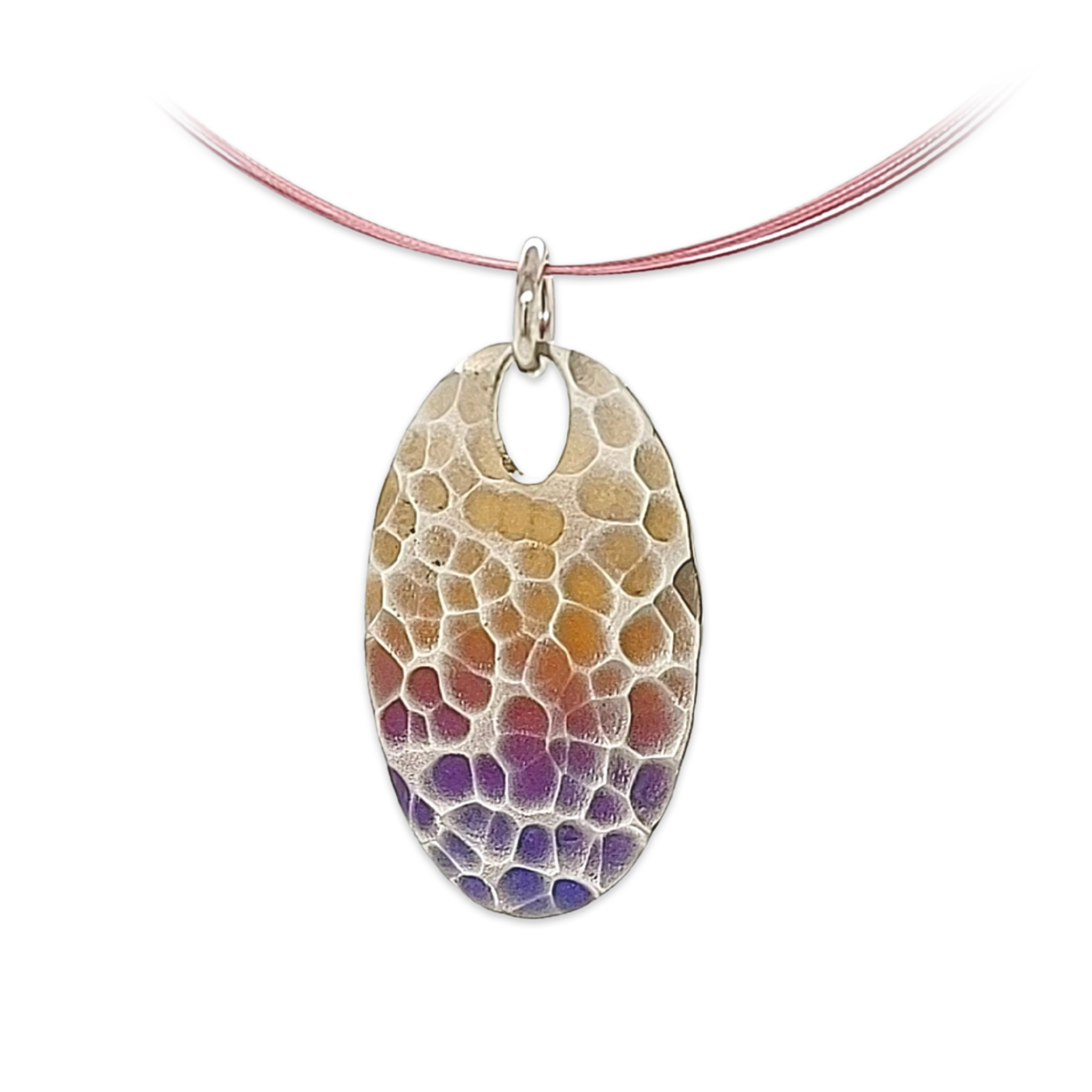 An oval pendant with yellow and purple ripple design pattern