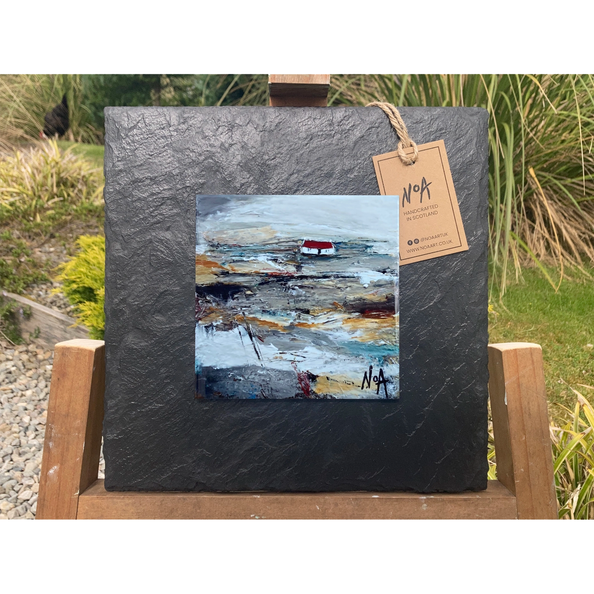 A tile mounted on slate featuring a textured painting of a bothie in the Highlands