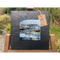 A tile mounted on slate featuring a textured painting of a bothie in the Highlands