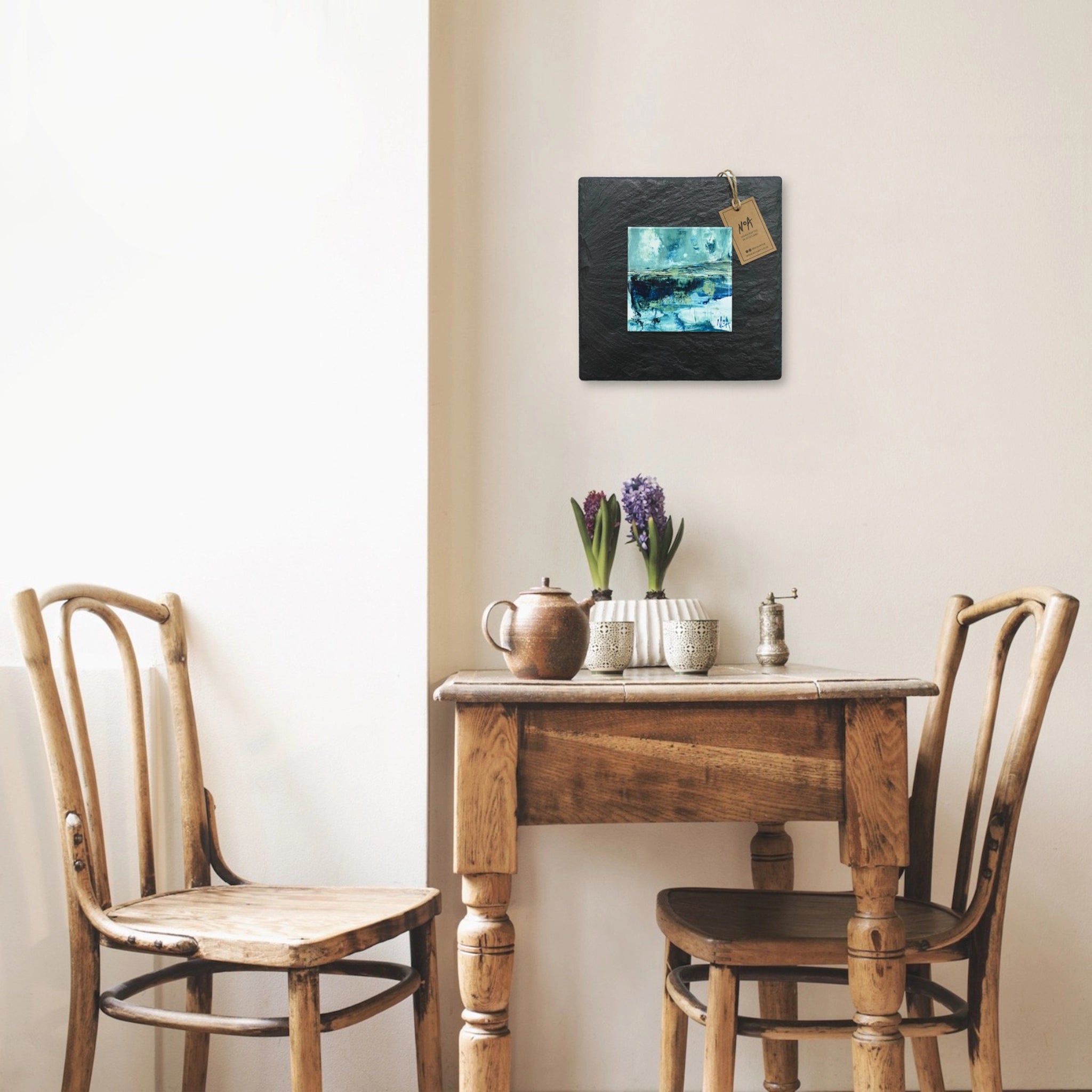 A tile mounted on slate featuring a textured painting of a water reflection on the West Coast of Scotland lifestyle