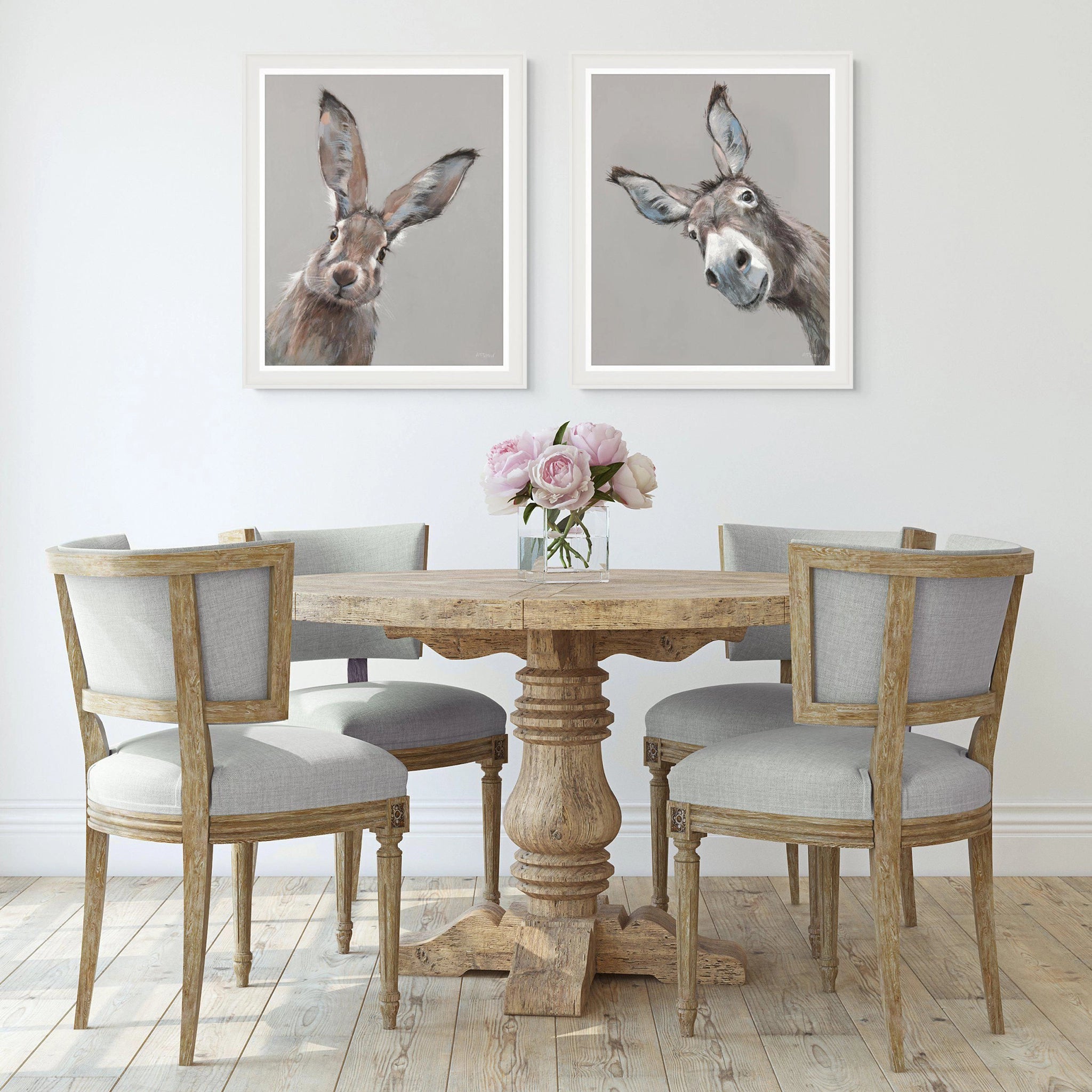 Two framed prints, one of a donkey and one of a hare, hung together on a wall