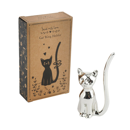 Shiny silver ring holder shaped like a cat with jewel eyes and a printed cardboard gift box