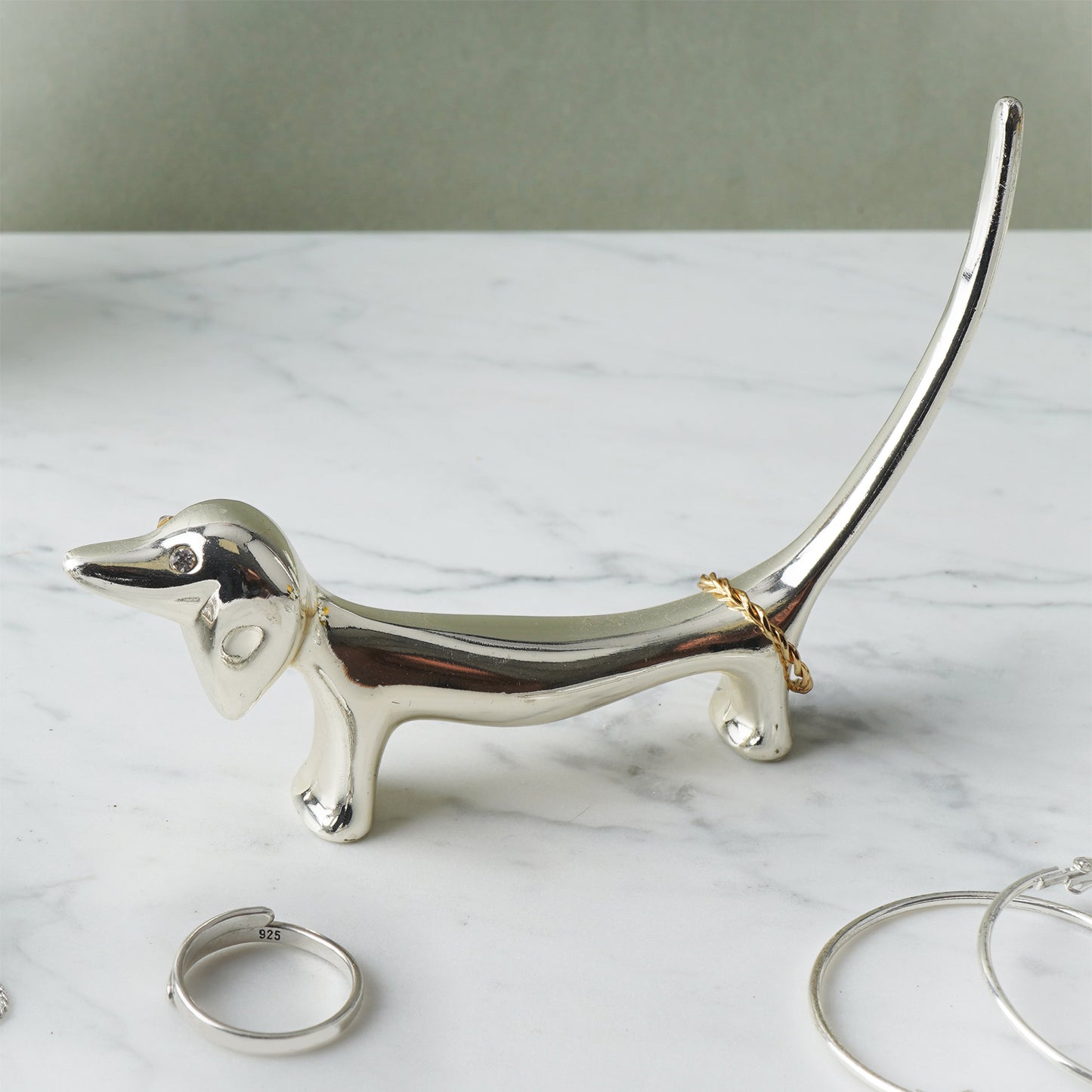 Silver dachshund shaped ring holder lifestyle