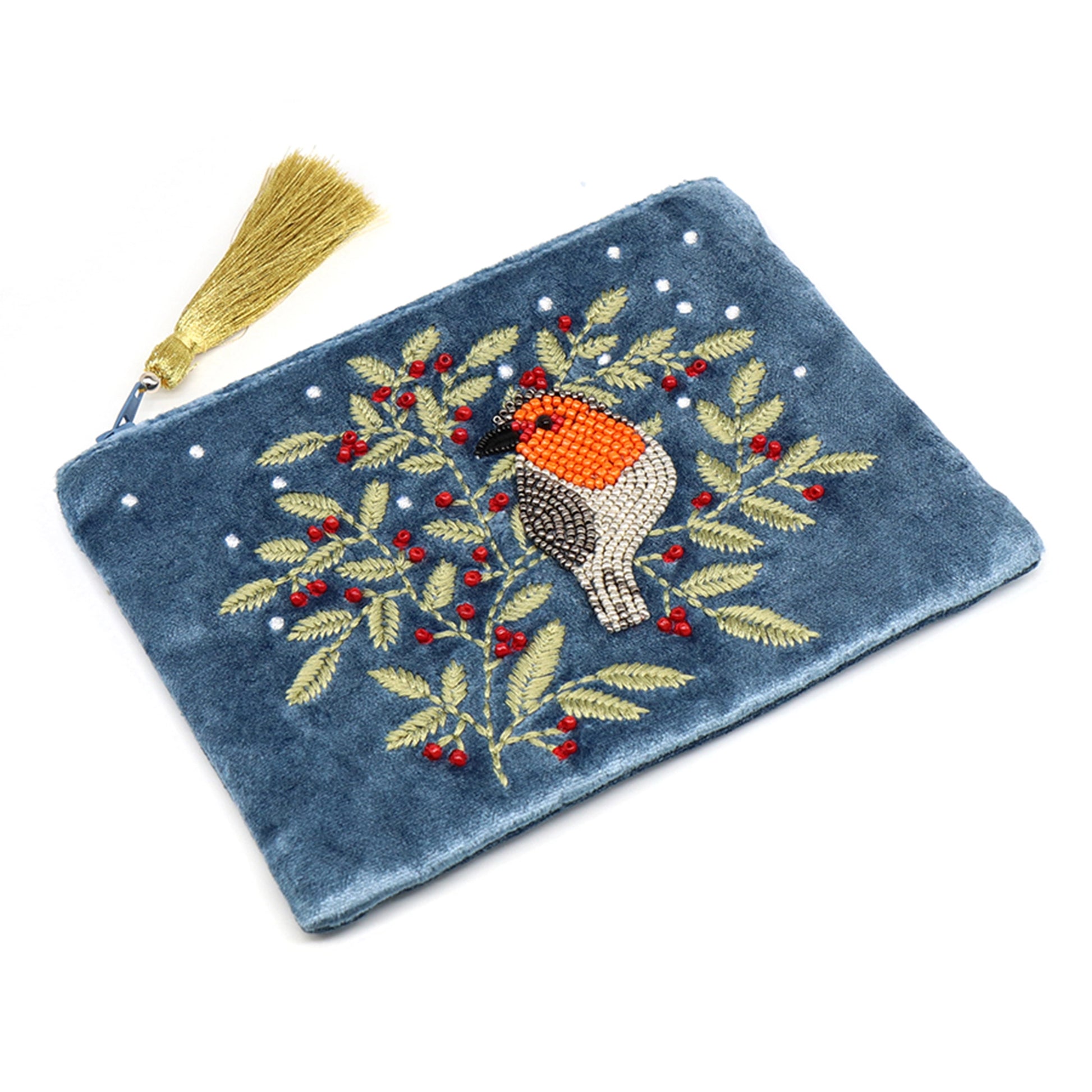 A dusky blue velvet pouch with a tassel on the zip and an embroidered and beaded robin and holly design