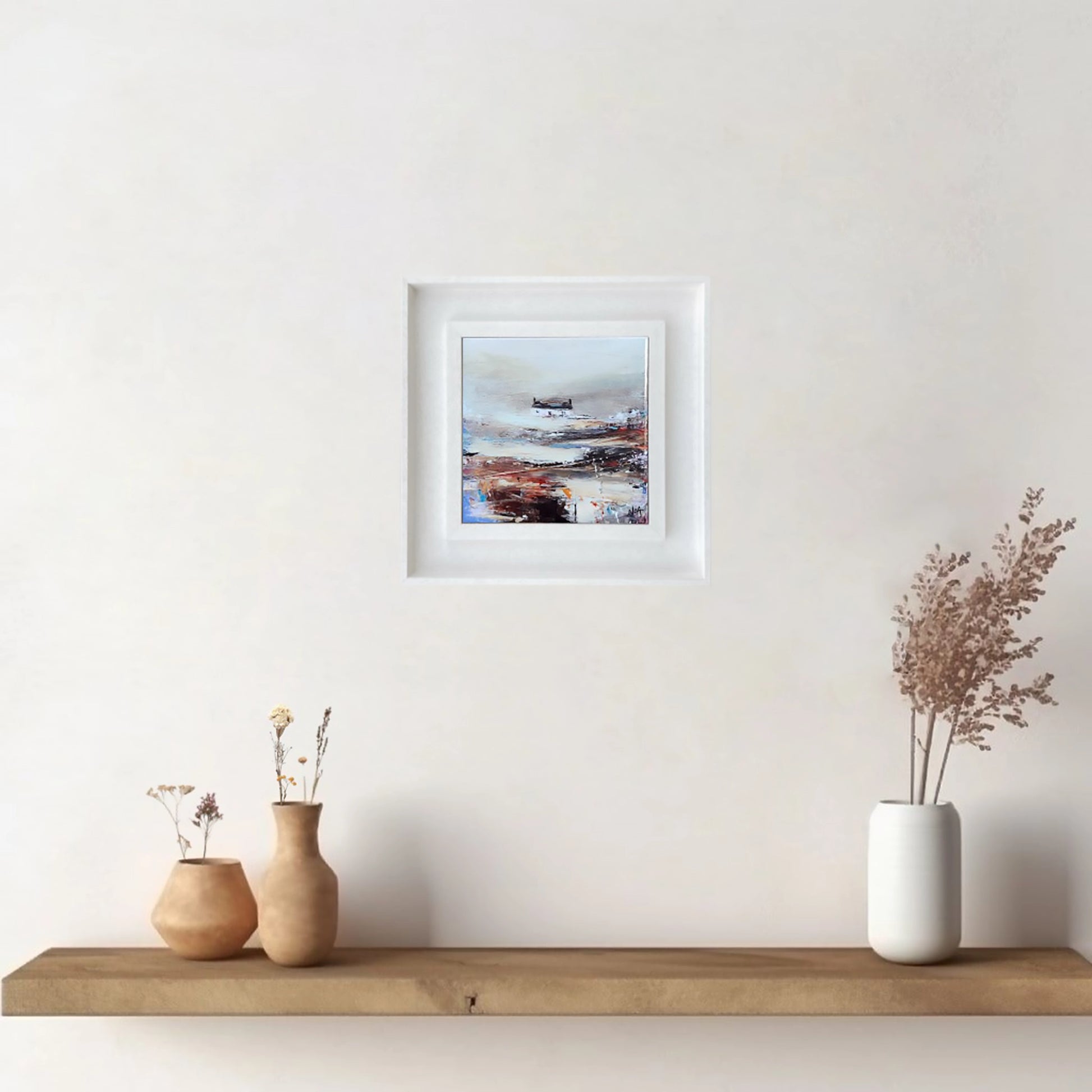 White framed tile art print featuring a white bothie on an abstract field in a mix of hues hanging