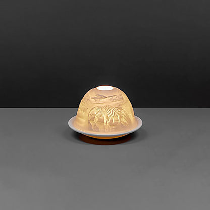 White porcelain dome candle holder with a safari scene back - on