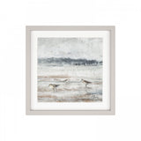 Framed print of sand pipers birds on a sandy beach at low tide in wispy greys and blues.