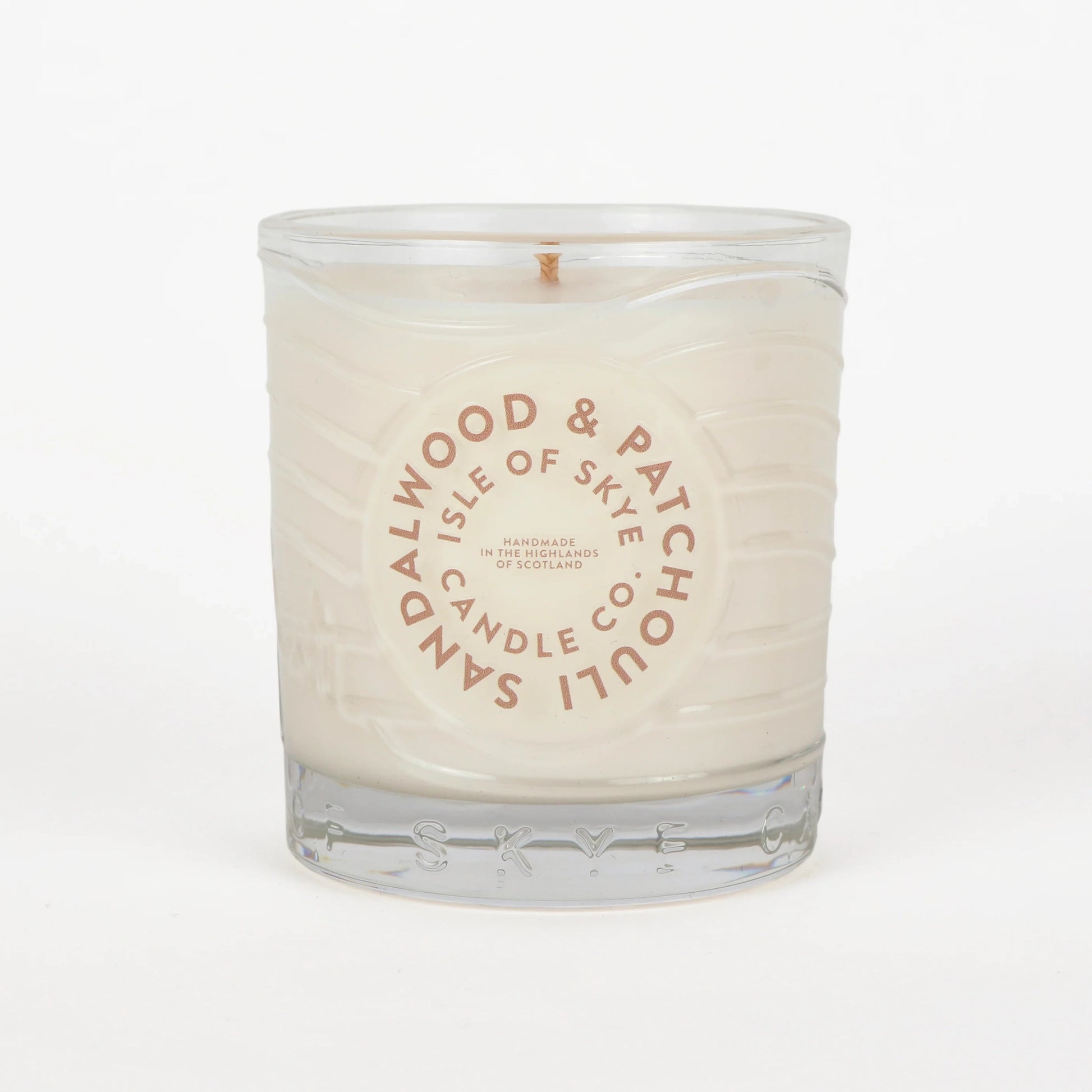 Sandalwood and patchouli scented candle in glass tumbler 