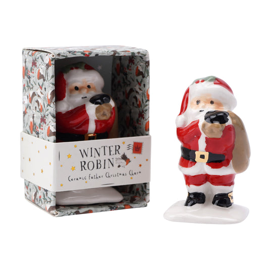 A ceramic red and white Santa carrying his present sack sculpture ornament with robin and holly decorated packaging box