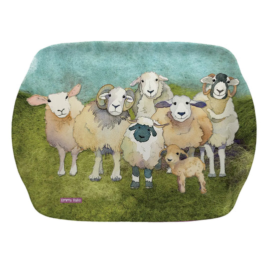 A small scatter dish tray with a design of sheep on a felted landscape background