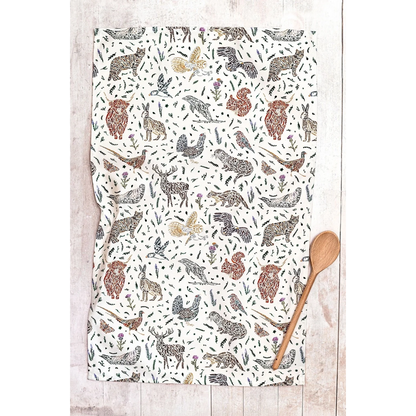 White cotton tea towel with Scottish wildlife design in florals