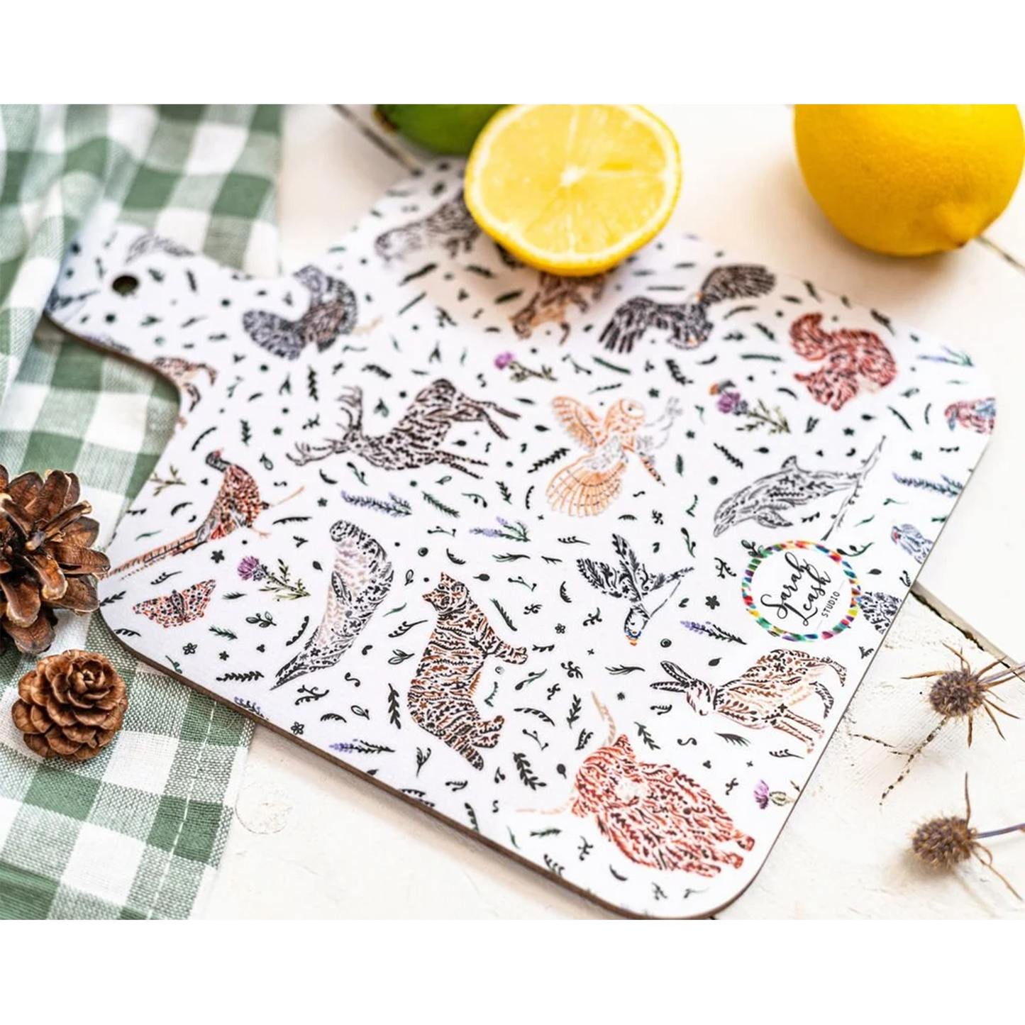 A double sided melamine chop board with a Scottish wildlife design