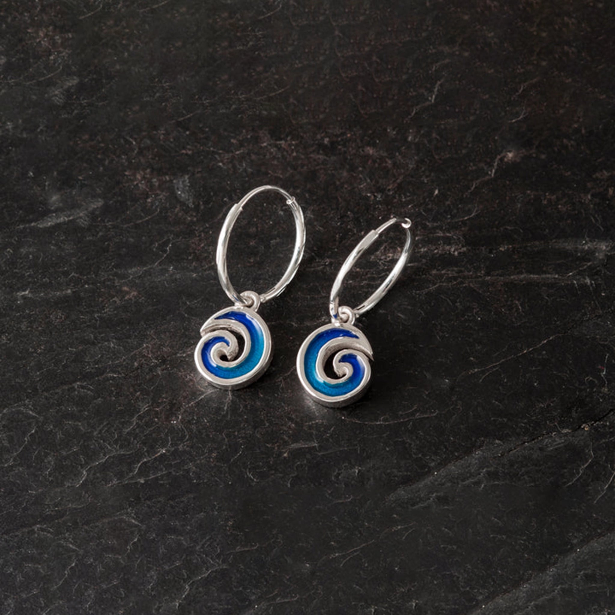 Silver hoop earrings with blue enamel wave shaped drop pendants