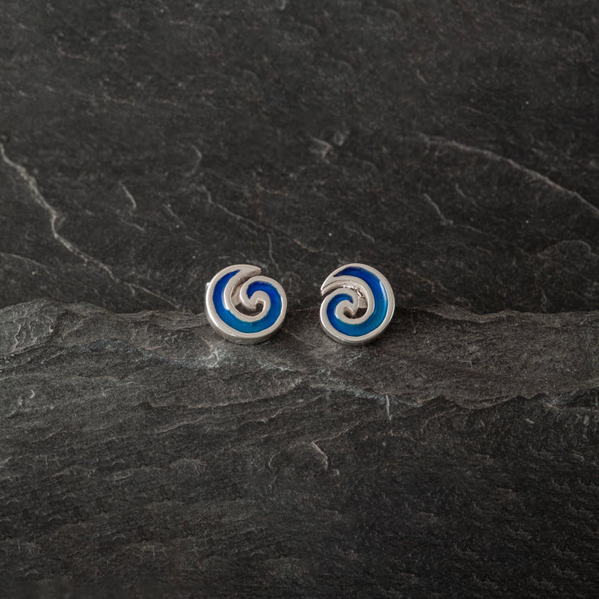 Round wave shaped stud earrings with vibrant blue enamelling