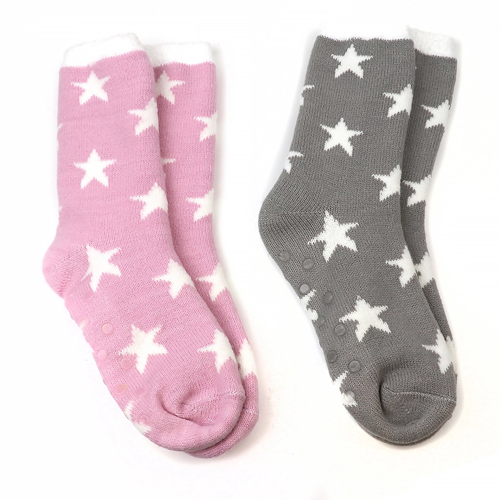 Two pairs of socks, one pink one grey, with white stars and grippers on the soles